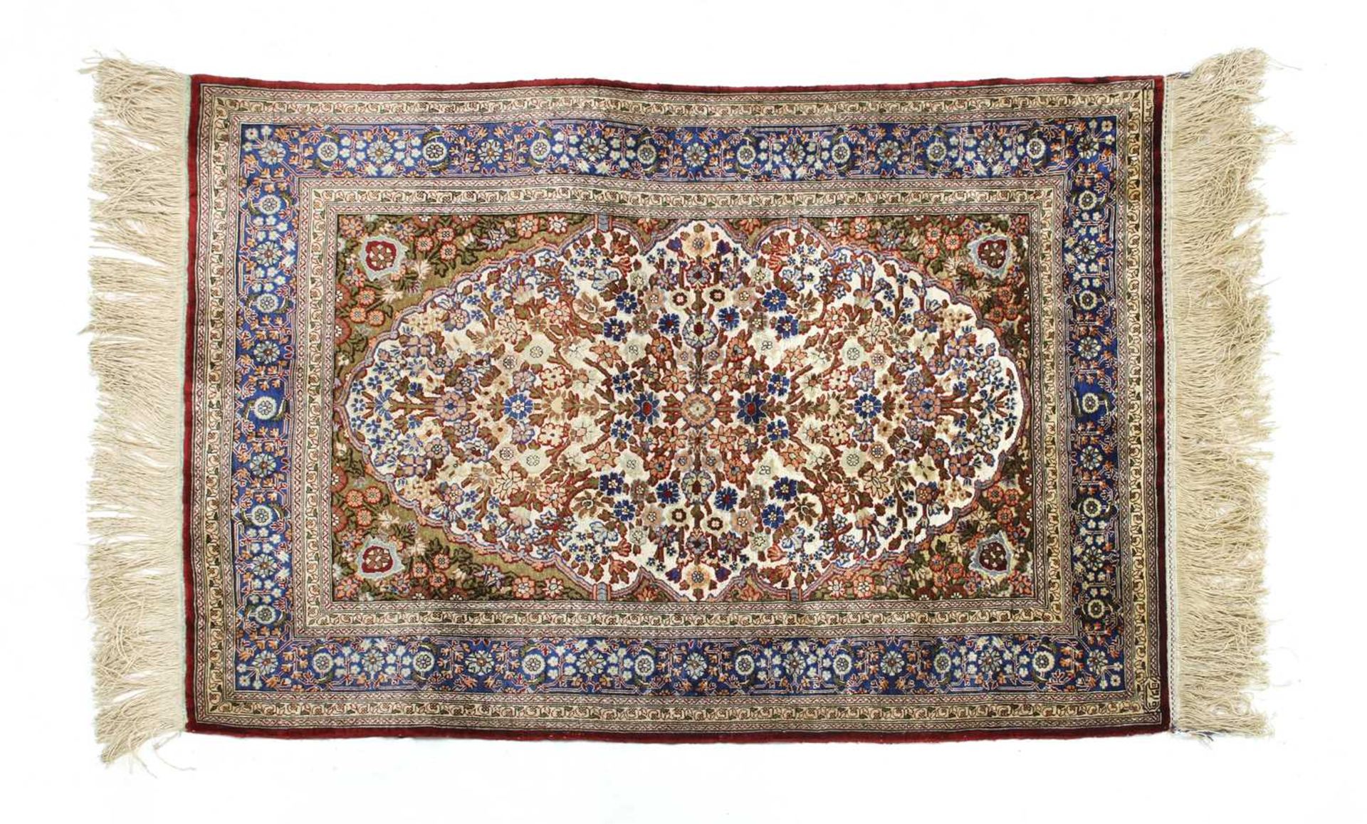 A Turkish silk and metal Hereke rug