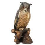 A large painted terracotta model of a long-eared owl,