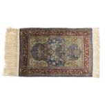 A Turkish silk and metal Hereke rug,