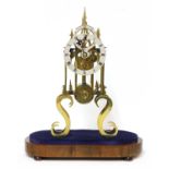 A Victorian brass single fusee skeleton clock