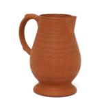 A Staffordshire redware baluster-shaped milk jug,