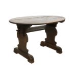 A Continental walnut oval centre table,
