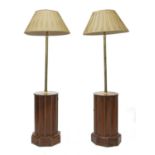 A pair of leather and brass-nailed drum base lamp standards,