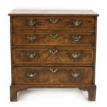 A George II-style walnut chest of drawers,
