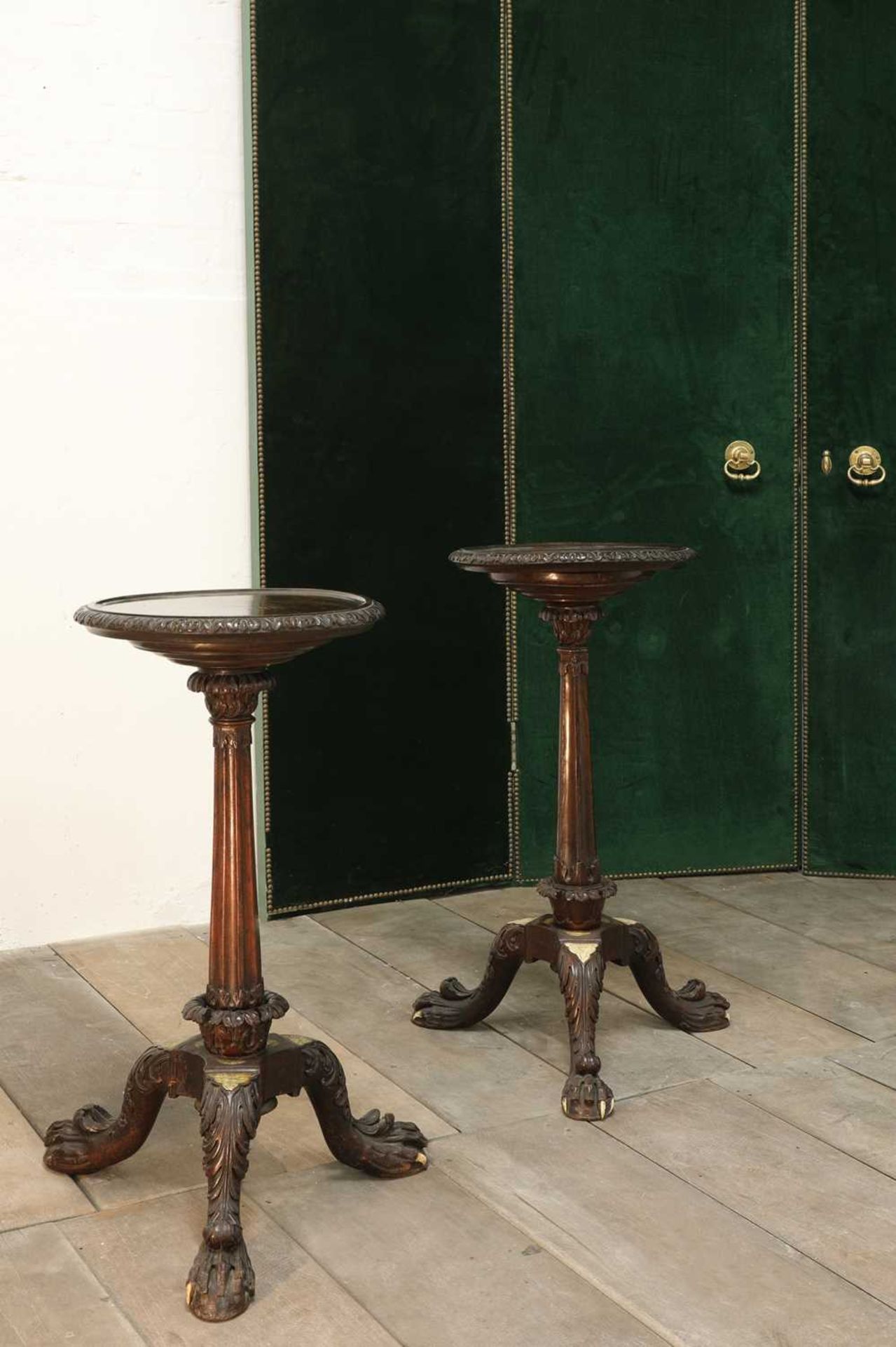 A near pair of Anglo-Indian padouk tripod tables,