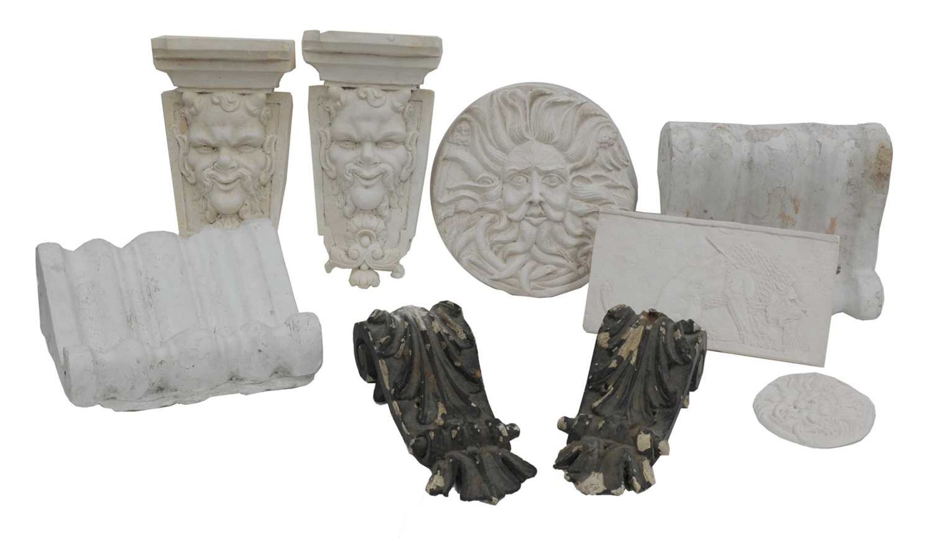 A collection of plaster corbels, brackets and plaques,