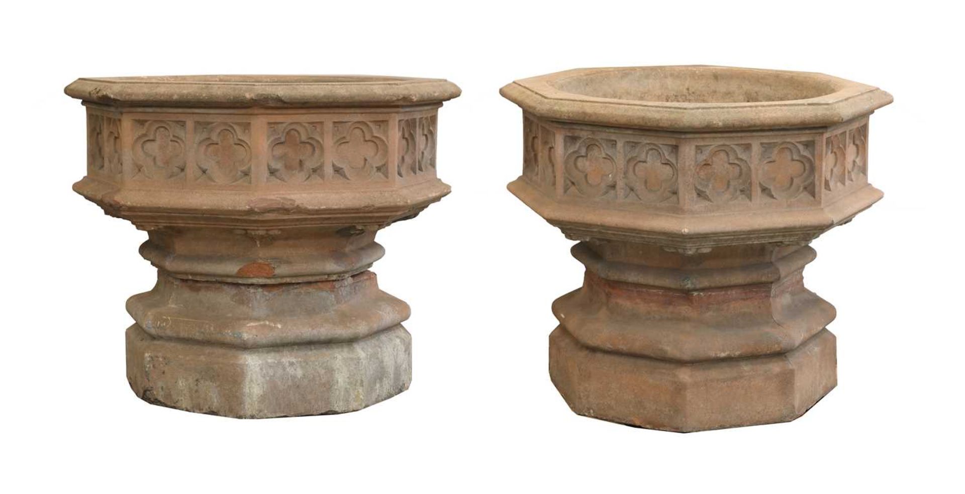 A pair of Indian sandstone octagonal planters,