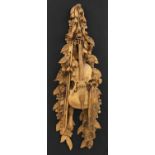 A carved wall hanging in the style of Grinling Gibbons,