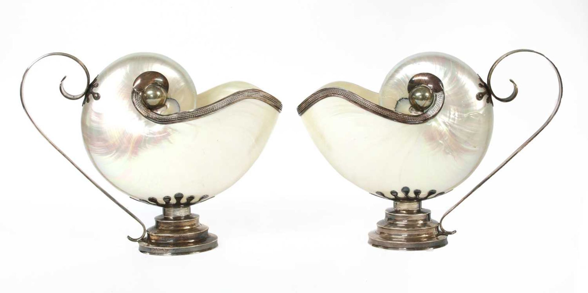 A pair of Tiffany sterling silver-mounted shell ewers,