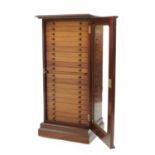 A mahogany collector's cabinet
