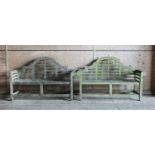 A pair of Lutyens-style weathered garden benches,