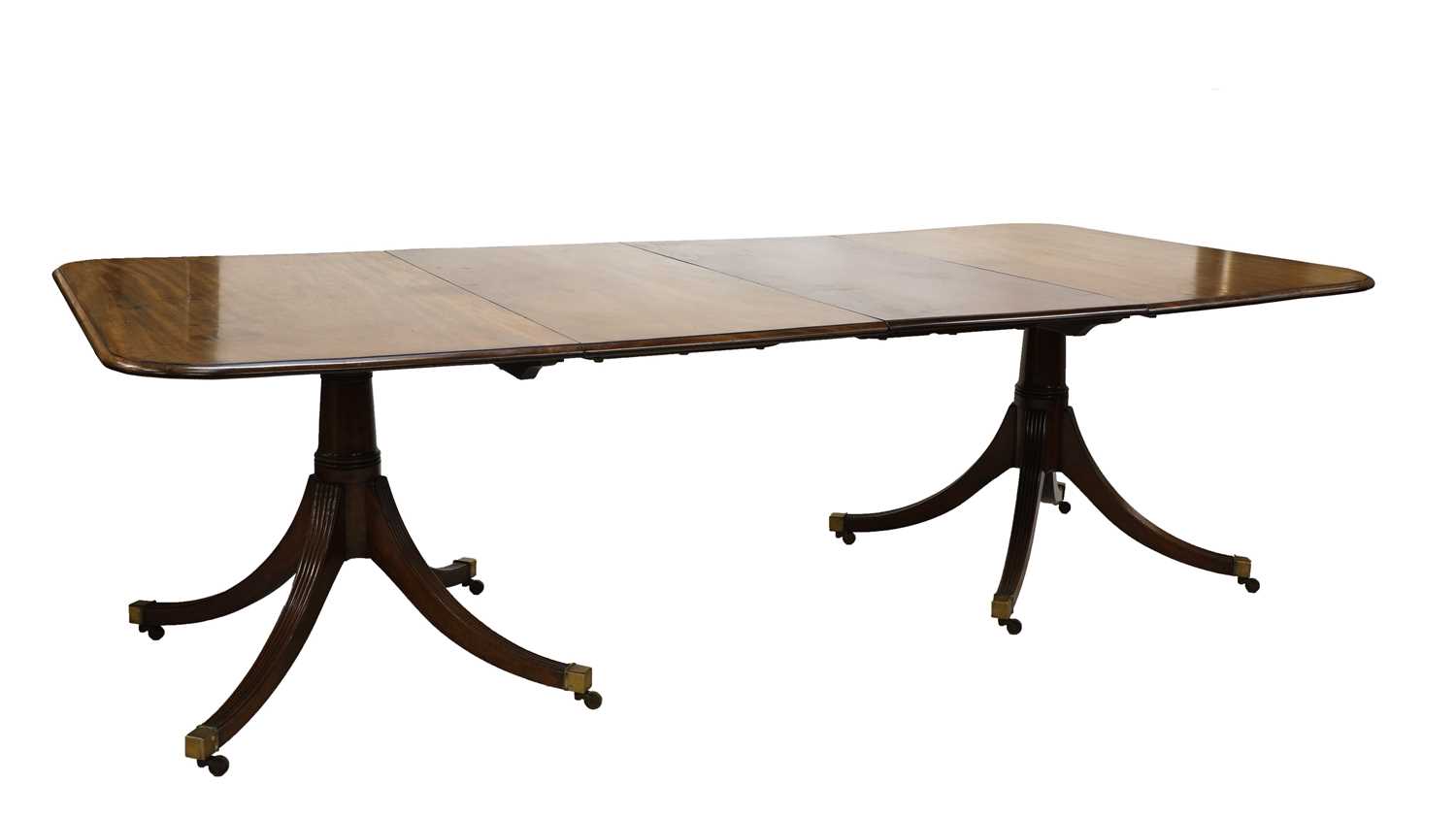 A George III-style mahogany twin pedestal dining table,