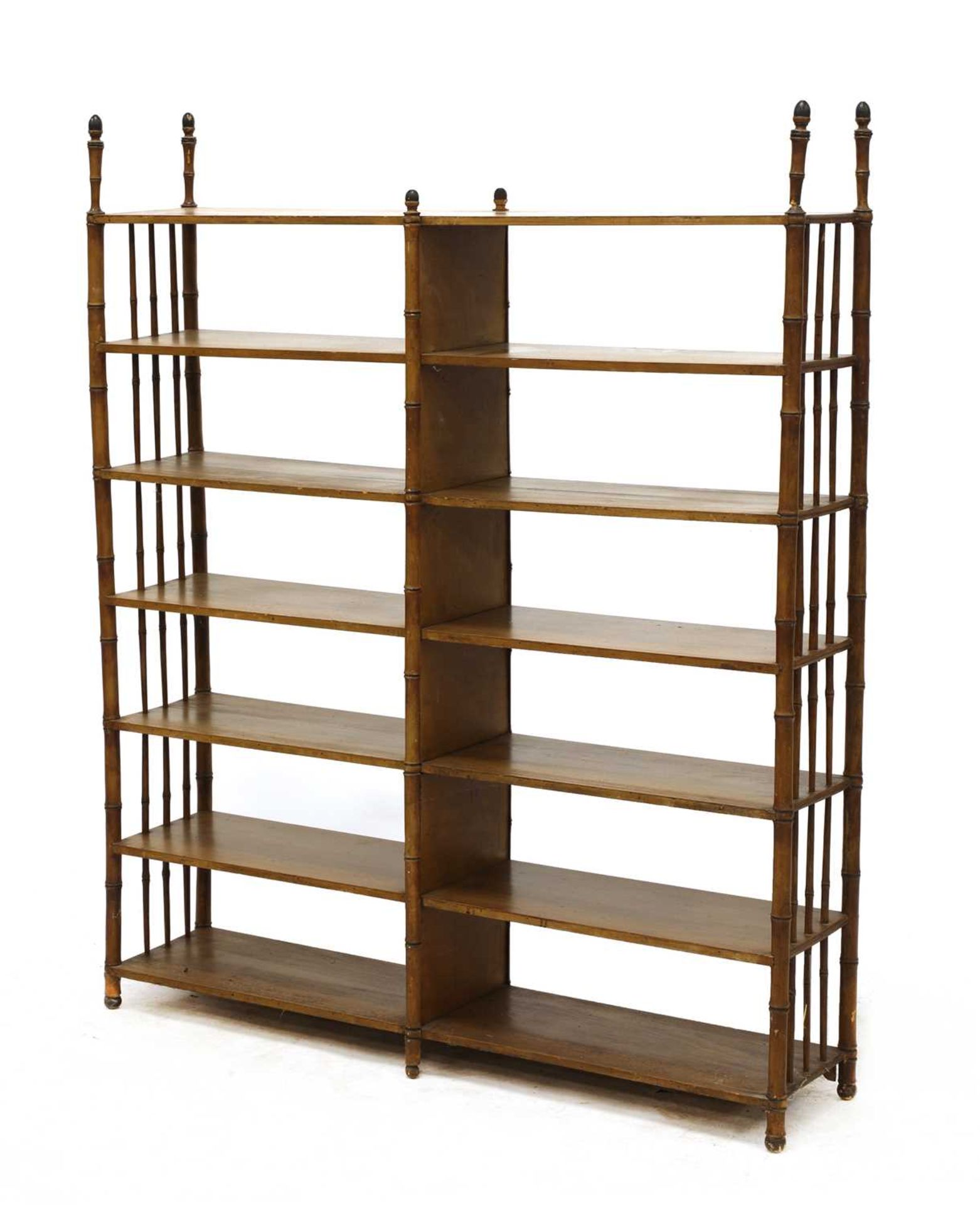 A set of faux bamboo open bookshelves,