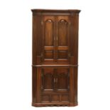 A George III mahogany standing corner cabinet,