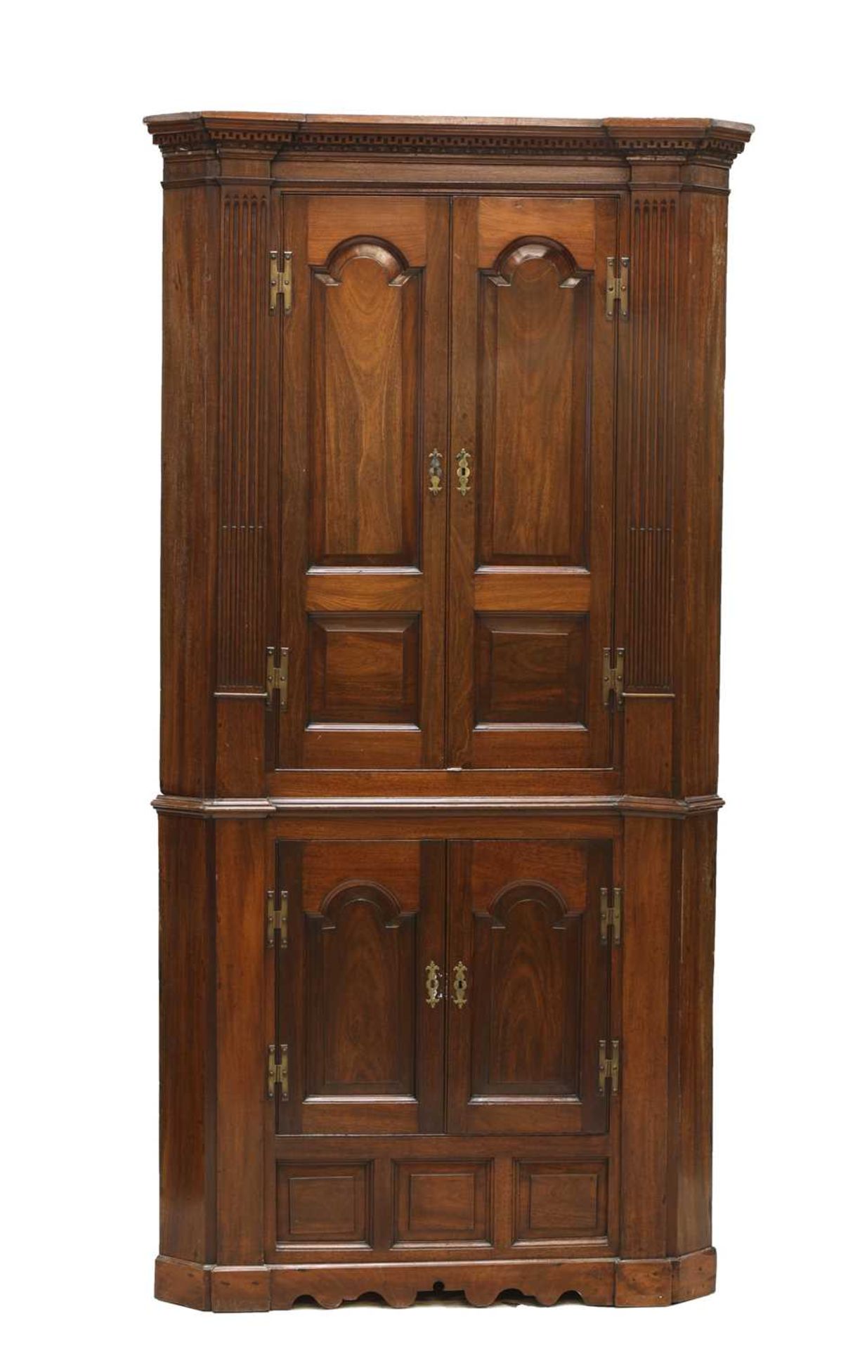 A George III mahogany standing corner cabinet,