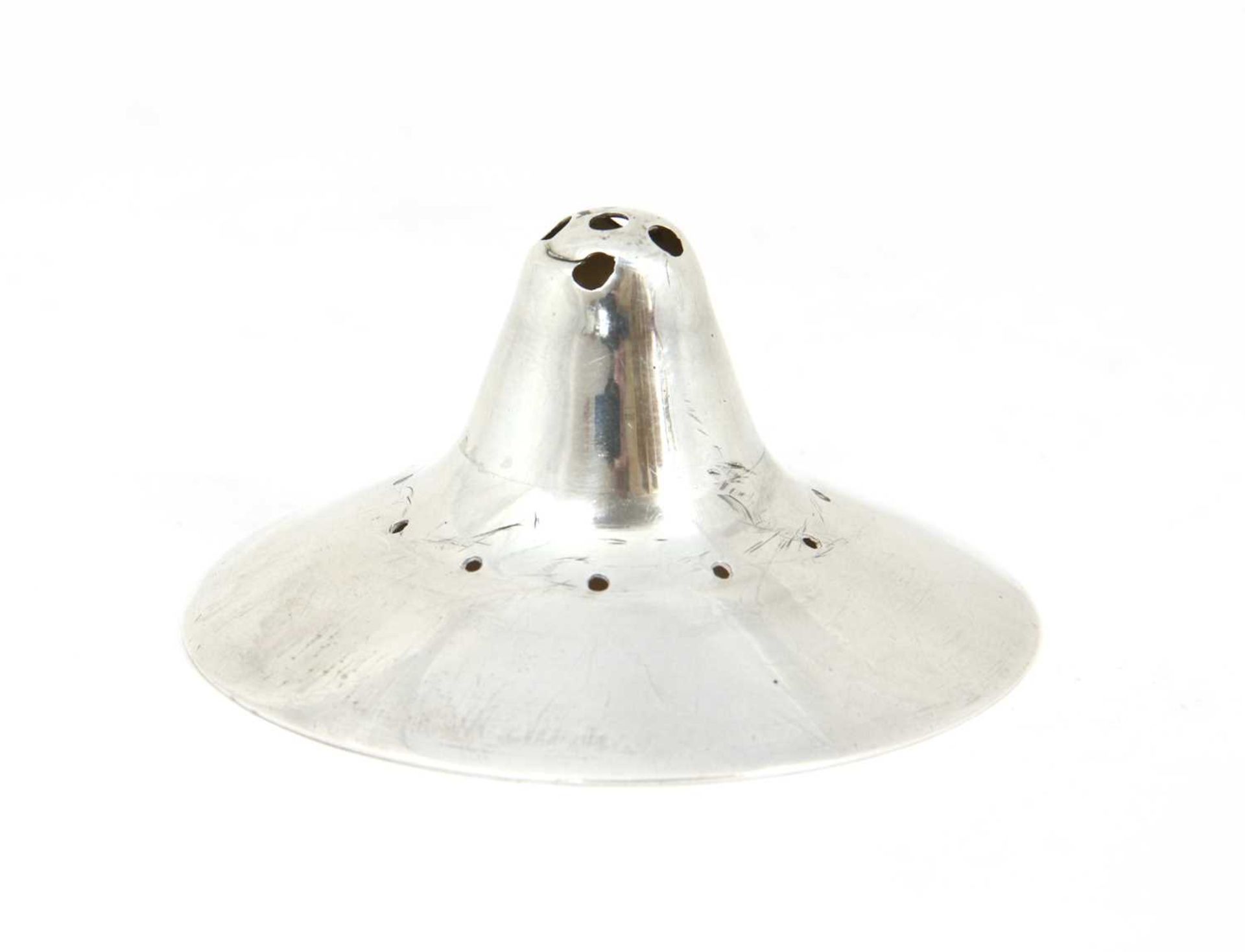 A George III silver nipple shield,