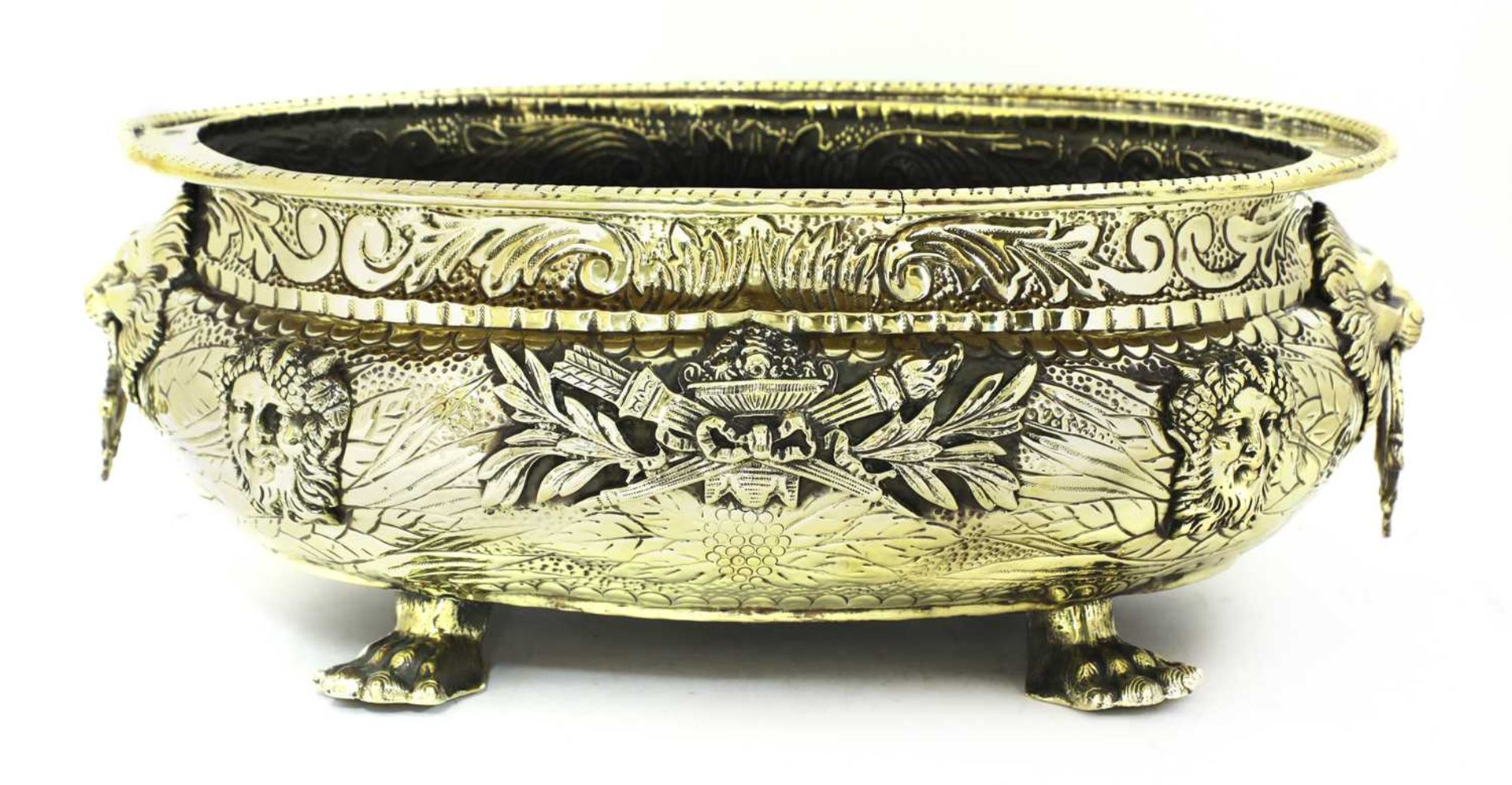 An embossed brass wine cooler,