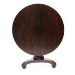 A small Regency rosewood circular pedestal table,