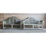 A pair of Lutyens-style weathered teak garden benches,