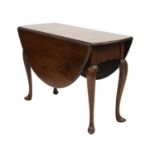 A George III mahogany oval drop-leaf table,