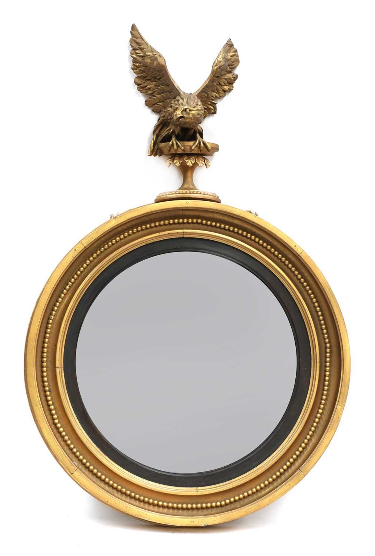 A Regency-style giltwood convex mirror,