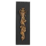 A carved wall hanging in the style of Grinling Gibbons,