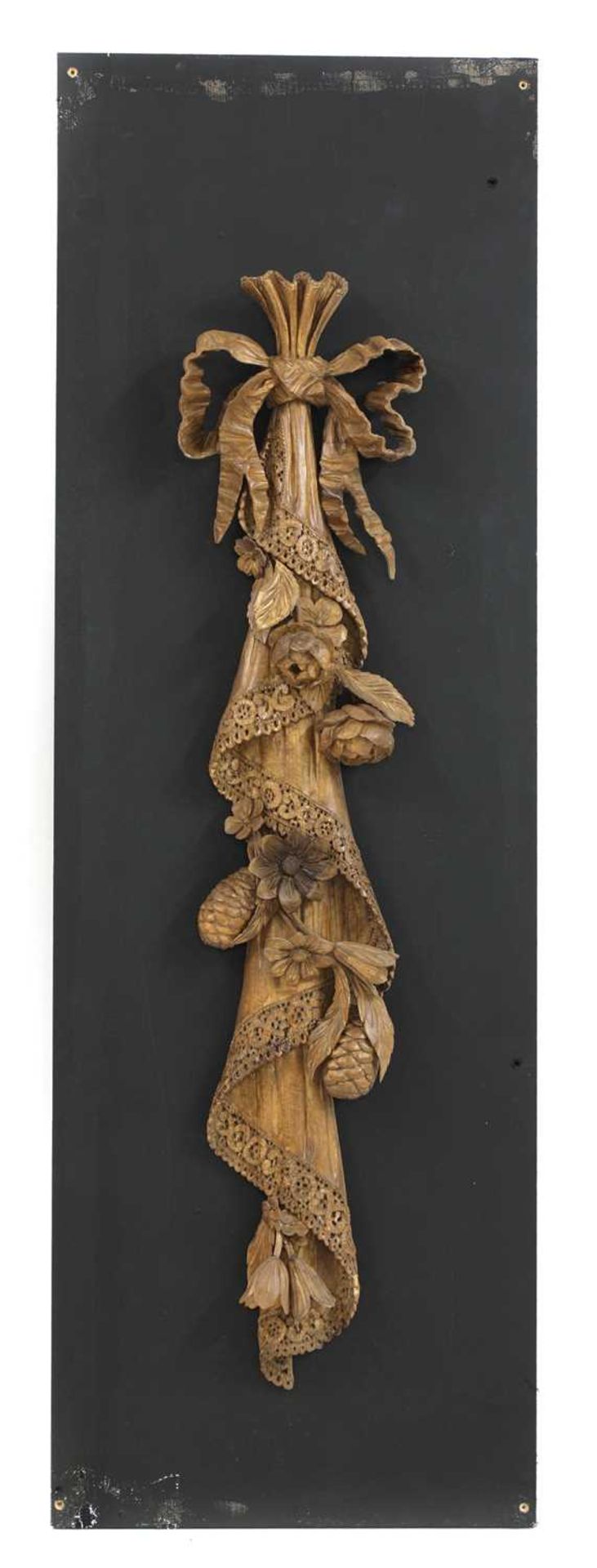 A carved wall hanging in the style of Grinling Gibbons,