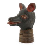 An extraordinary carved, lacquered and painted wood animal head