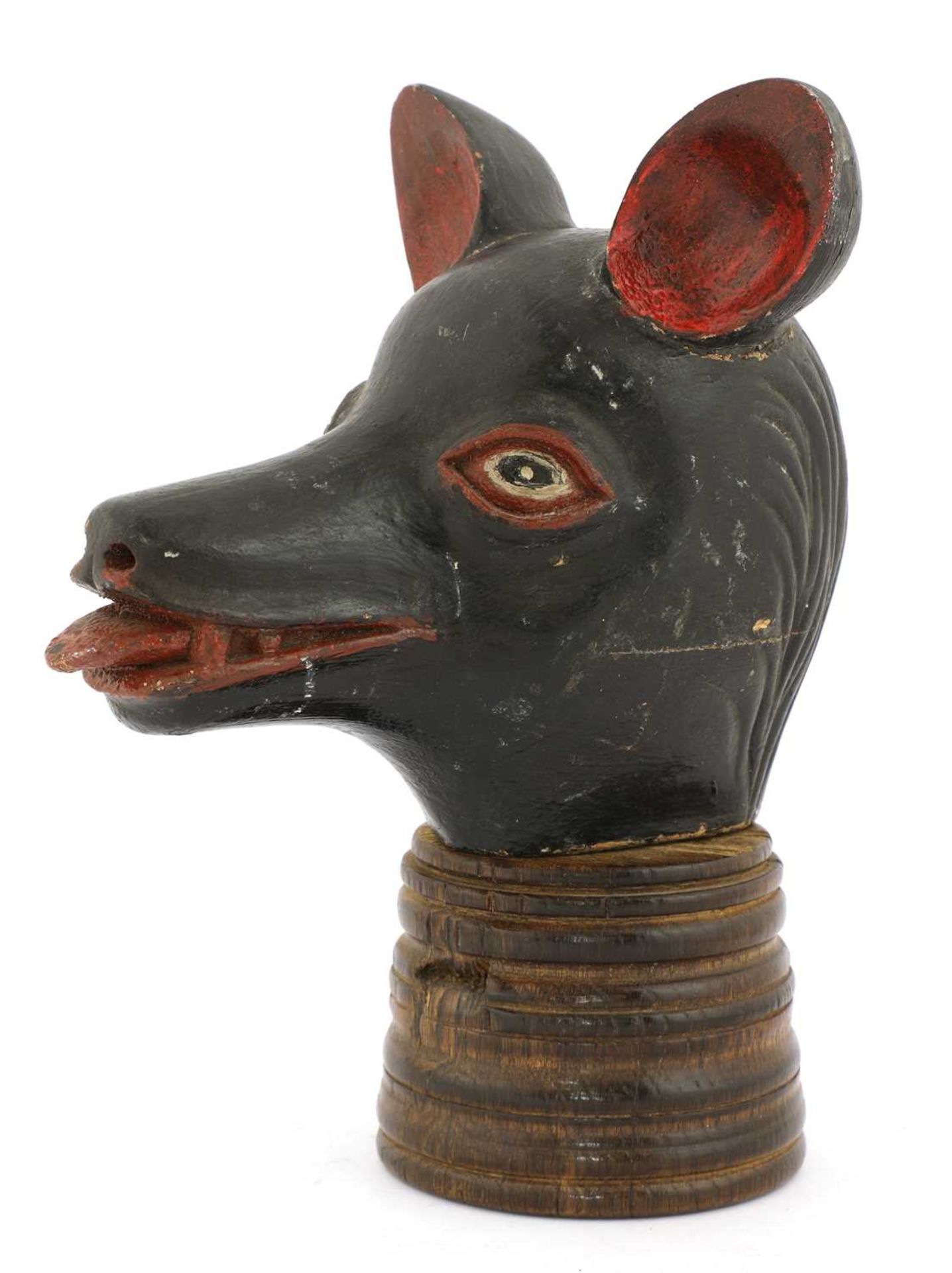 An extraordinary carved, lacquered and painted wood animal head