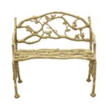 A small faux bois cast iron garden seat,