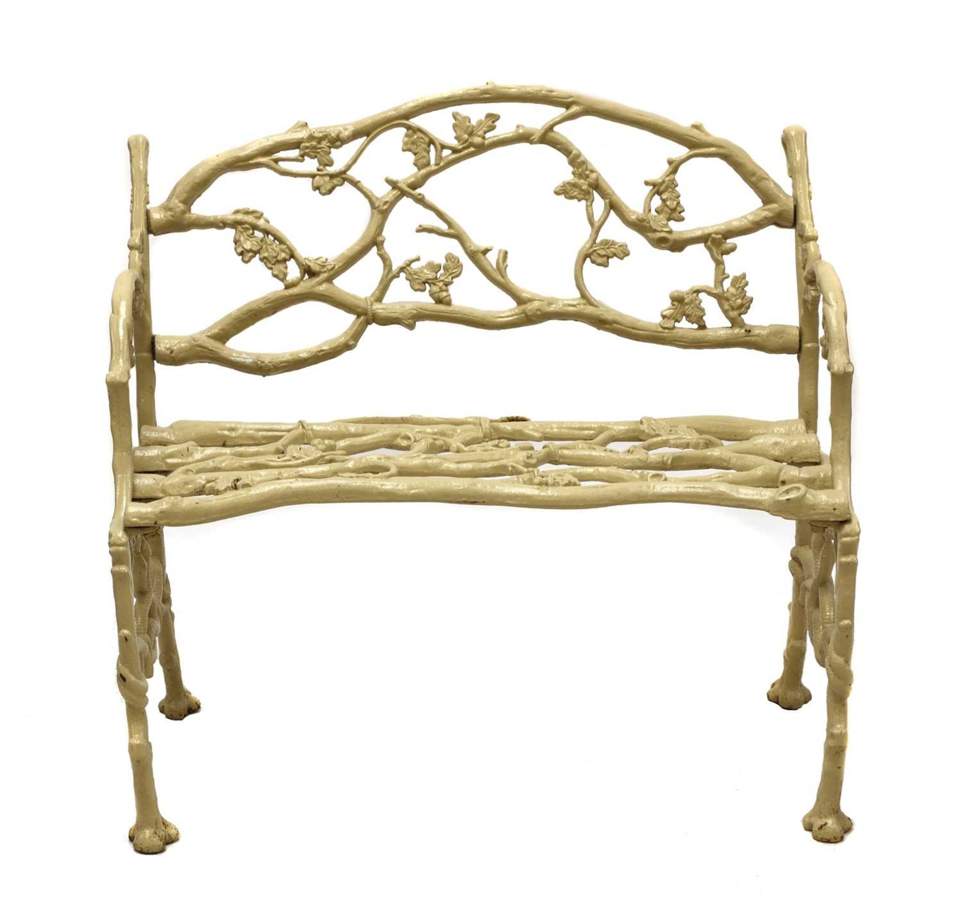 A small faux bois cast iron garden seat,