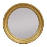 A giltwood convex wall mirror,