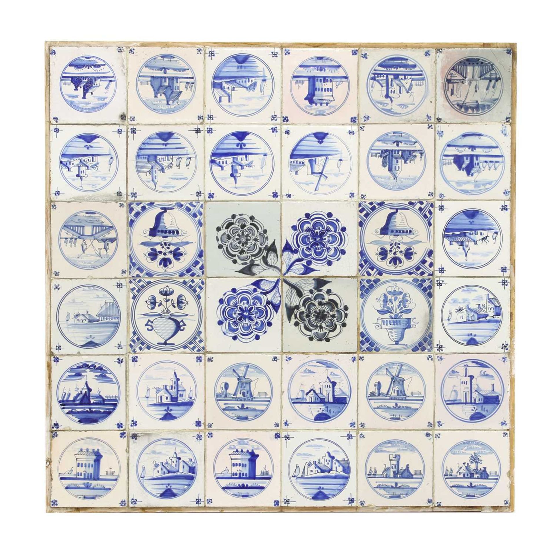 A panel of thirty-six delftware blue and white tiles,