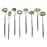 A collection of eight silver toddy ladles,