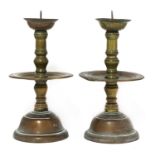 A pair of bronze Heemskerk-type candlesticks,