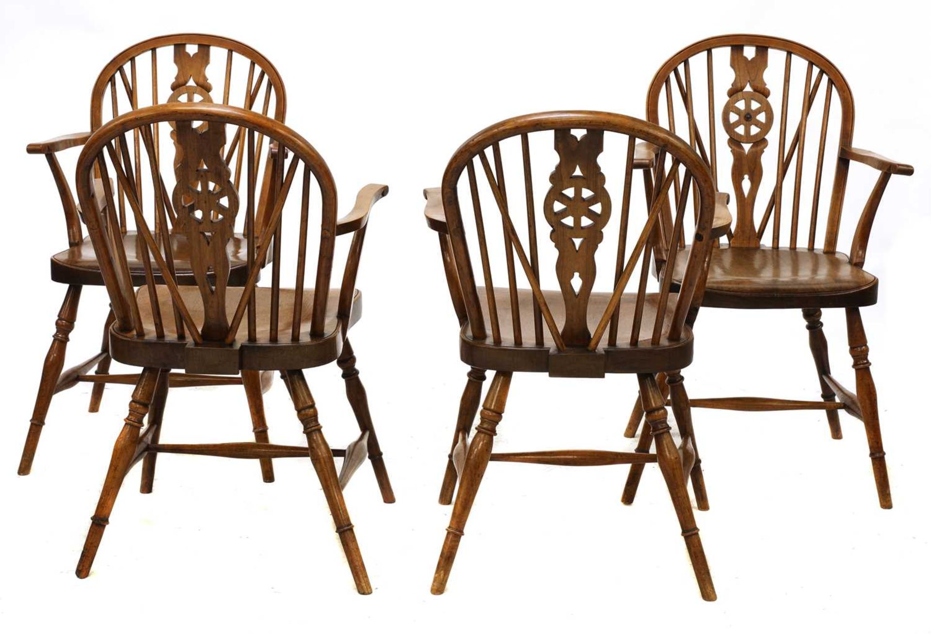 A set of four walnut and fruitwood wheel back Windsor chairs, - Image 3 of 5