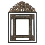 A baroque-style cushion mirror,