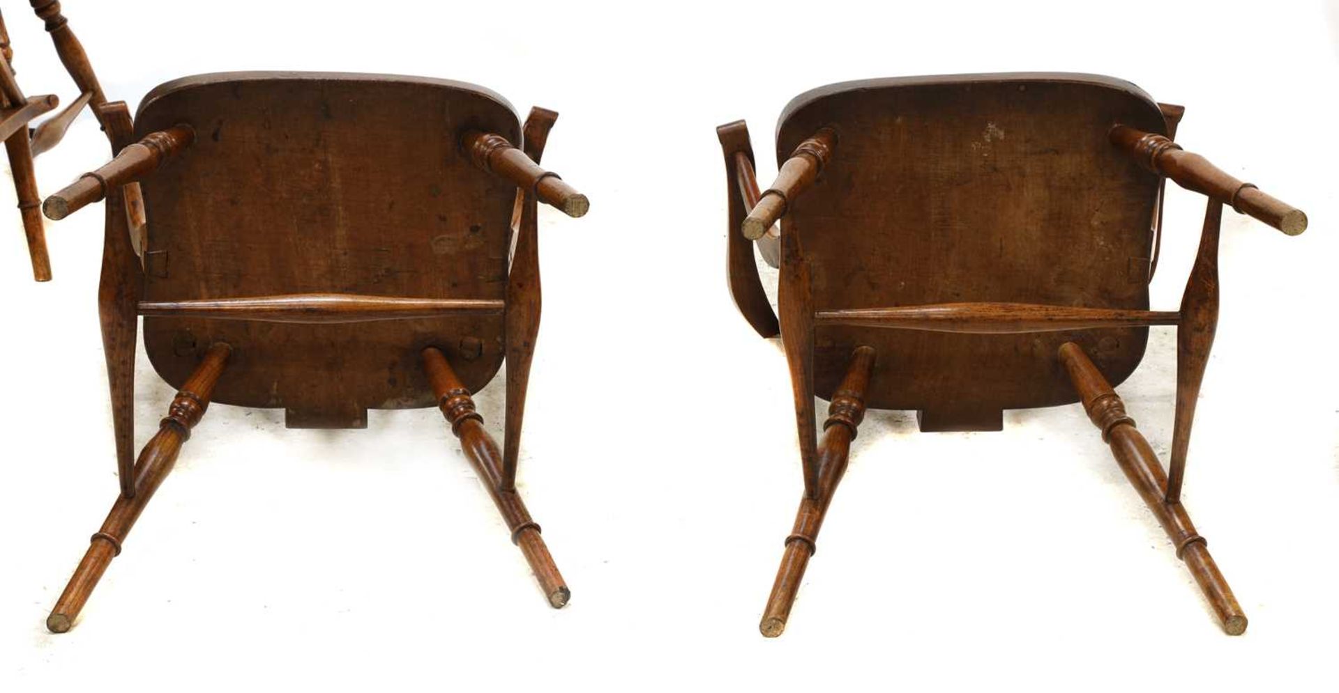 A set of four walnut and fruitwood wheel back Windsor chairs, - Image 5 of 5