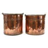 A pair of copper fireside buckets,