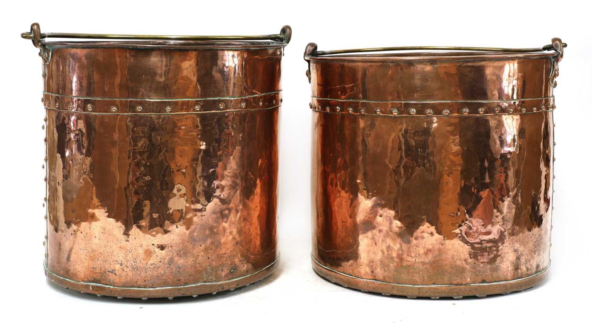 A pair of copper fireside buckets,