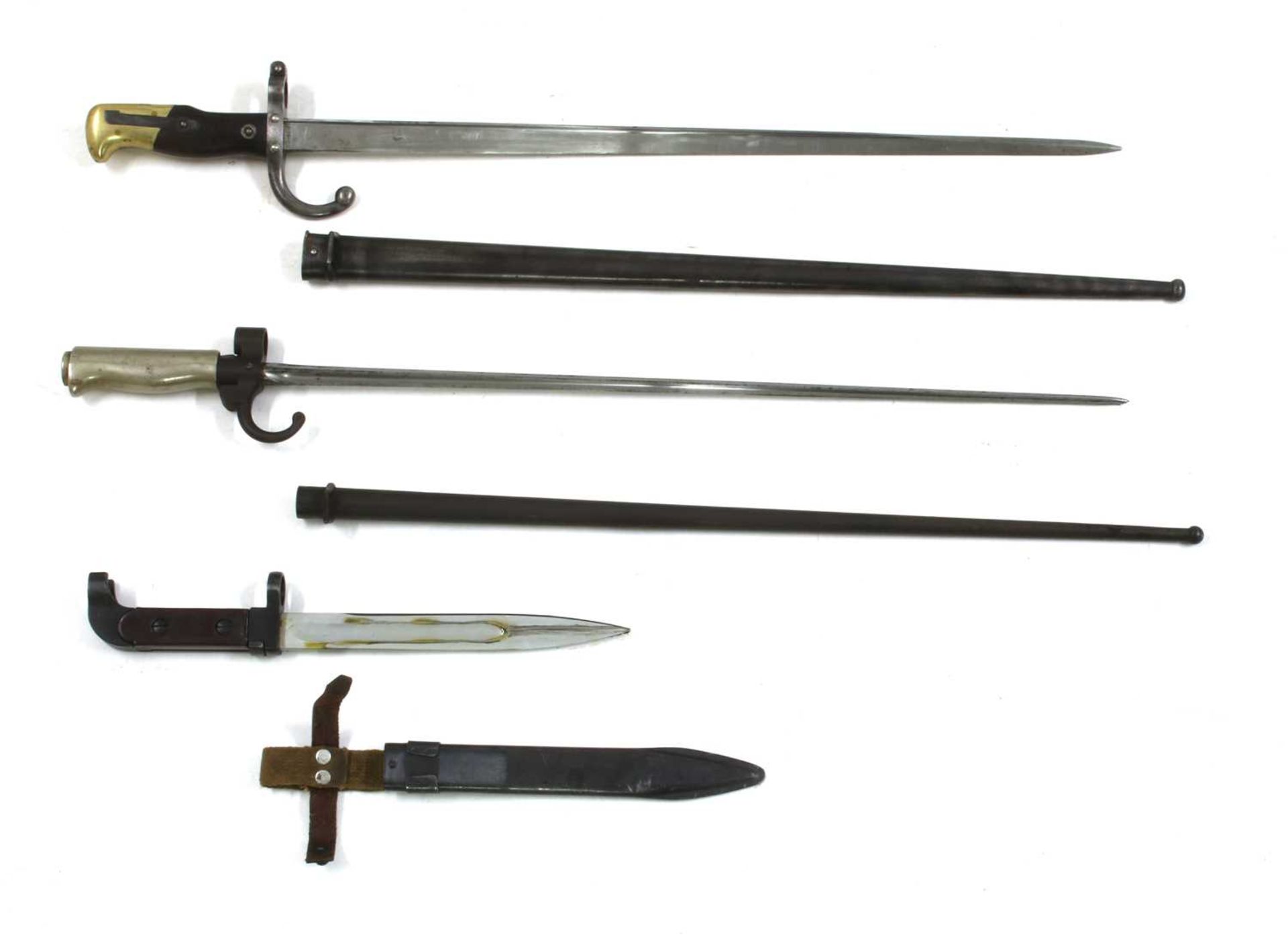 Two Martini Henry rifle bayonets with scabbards,