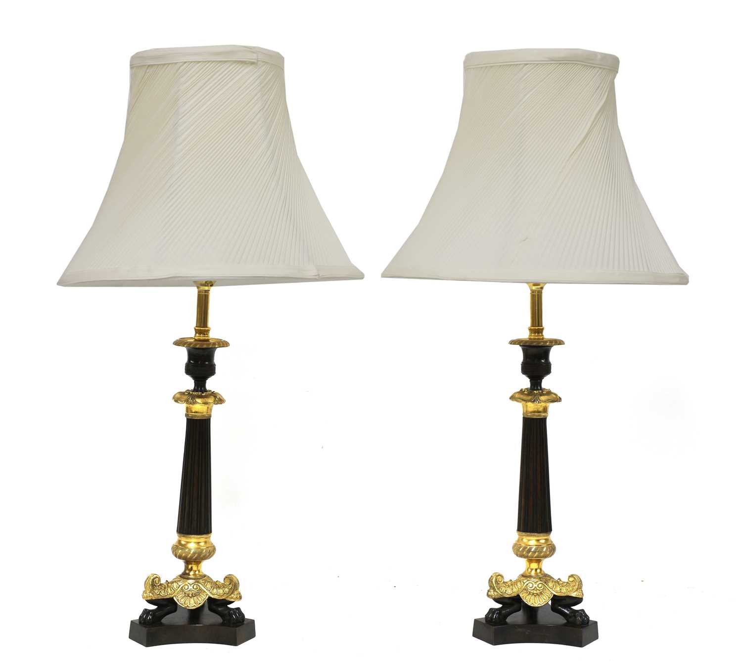 A pair of French Empire-style bronze and gilt-bronze candlesticks,