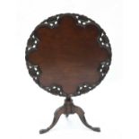 A mahogany tripod table,
