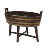 A George III mahogany oval brass-bound wine cooler,