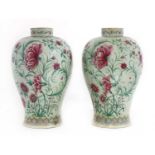 A pair of porcelain baluster vases,