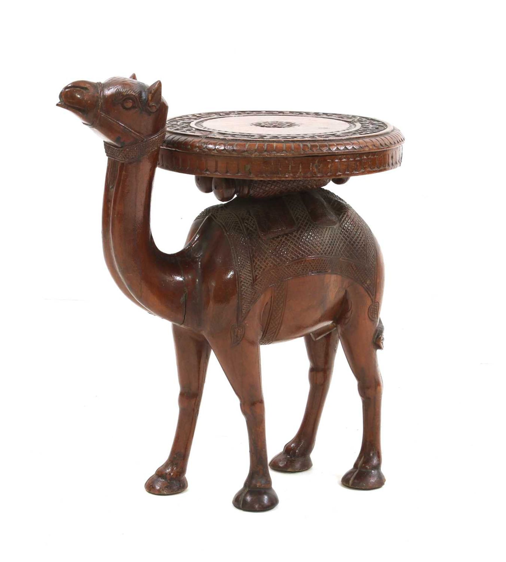 An Indian carved teak occasional table,