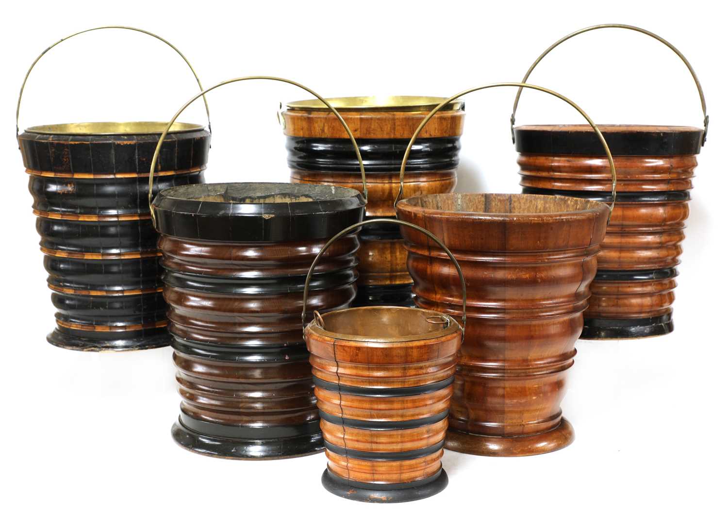 A collection of five Dutch turned wooden peat buckets,