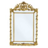 A French carved giltwood and composition wall mirror,