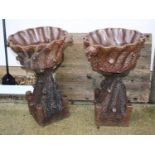 A pair of stoneware urns on stands,