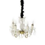 A cut glass and brass five branch chandelier,